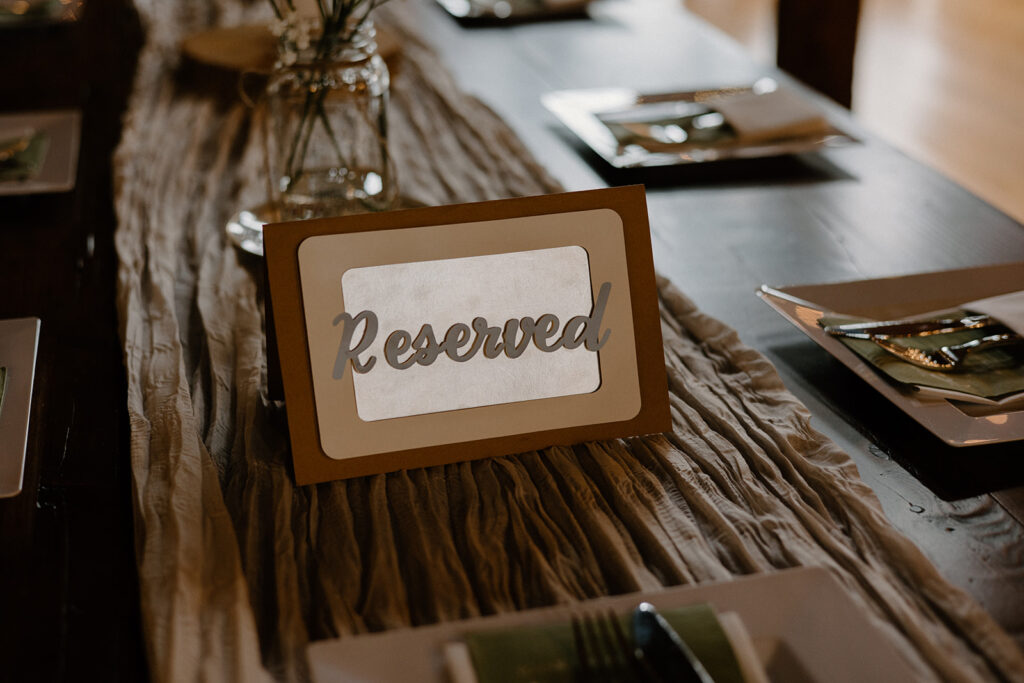 Wedding reception reserved table signage.
