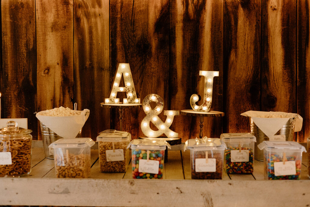 Rustic wedding dessert table and light up bride and groom initials.
