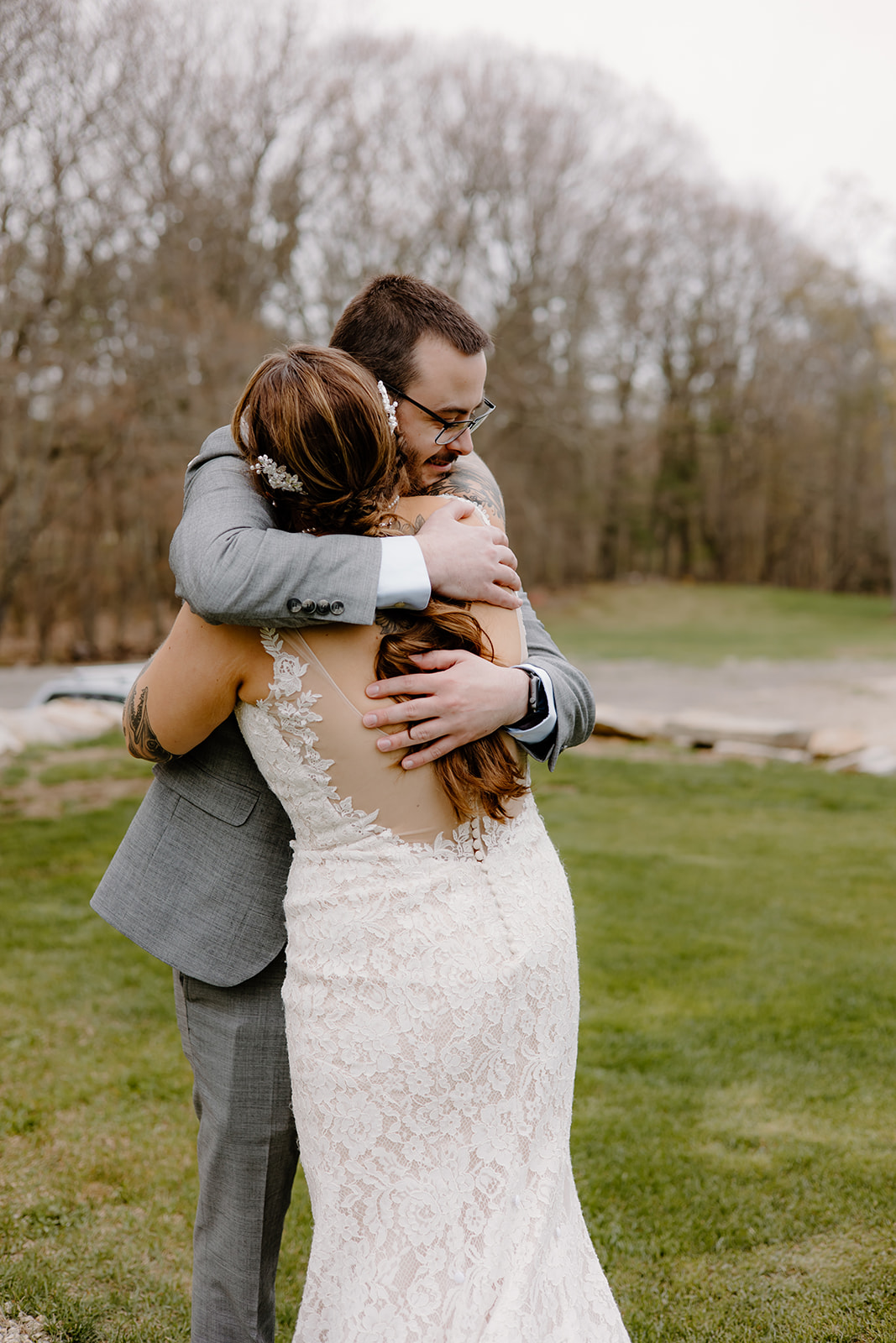 Bride hugging her brother after a tender pre-ceremony first look.