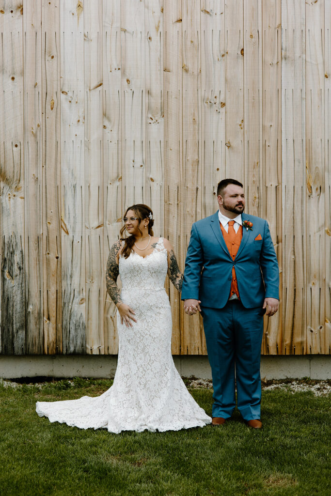 Bride and groom portrait outside the Powder Major's Farm in Madbury, New Hampshire.
