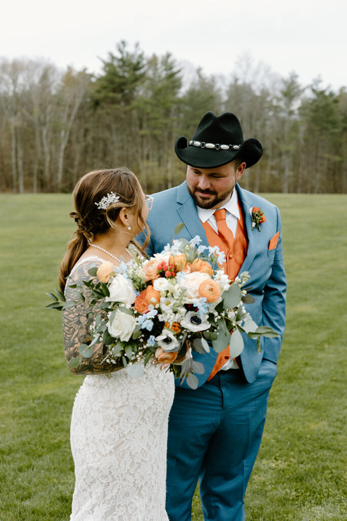 Rustic orange and blue wedding newlywed portraits in New Hampshire.