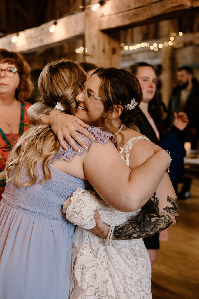 Bride hugging one of her guests during the reception.