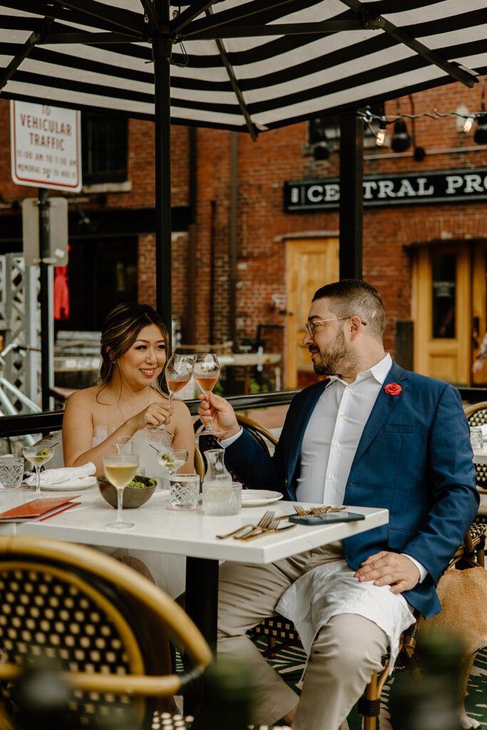 Couple sharing a drink at a local brewery in Portland Maine.