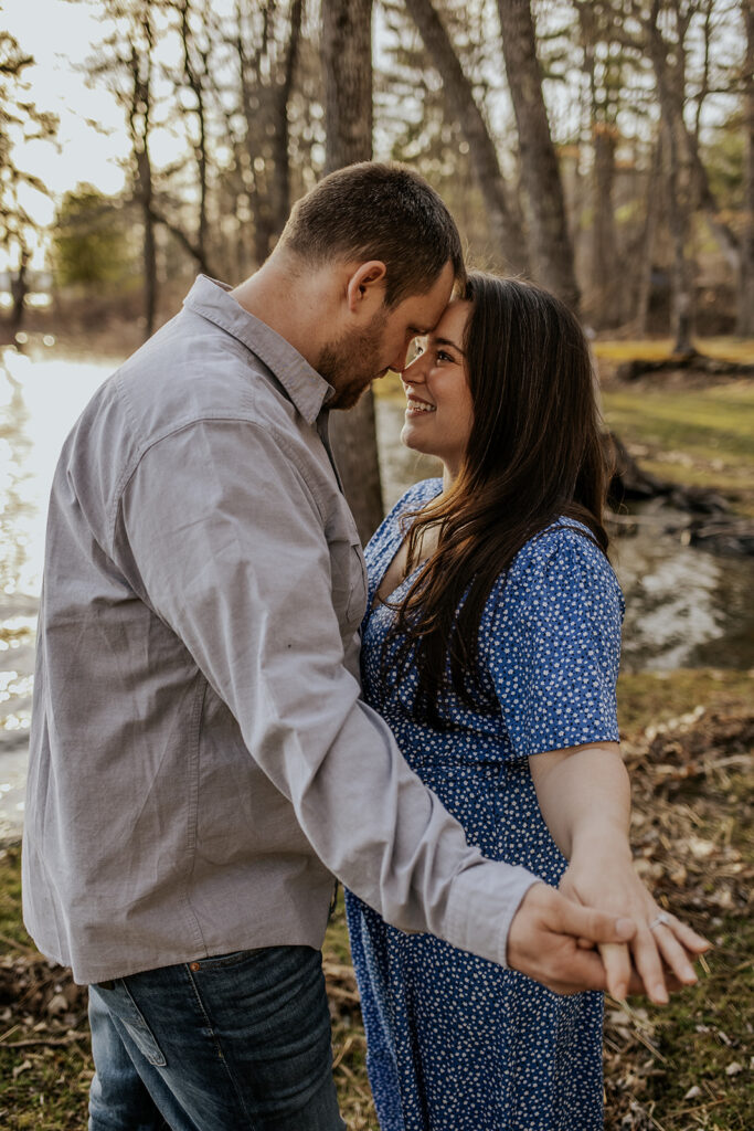Couple posing for their engagement photoshoot in Maine.