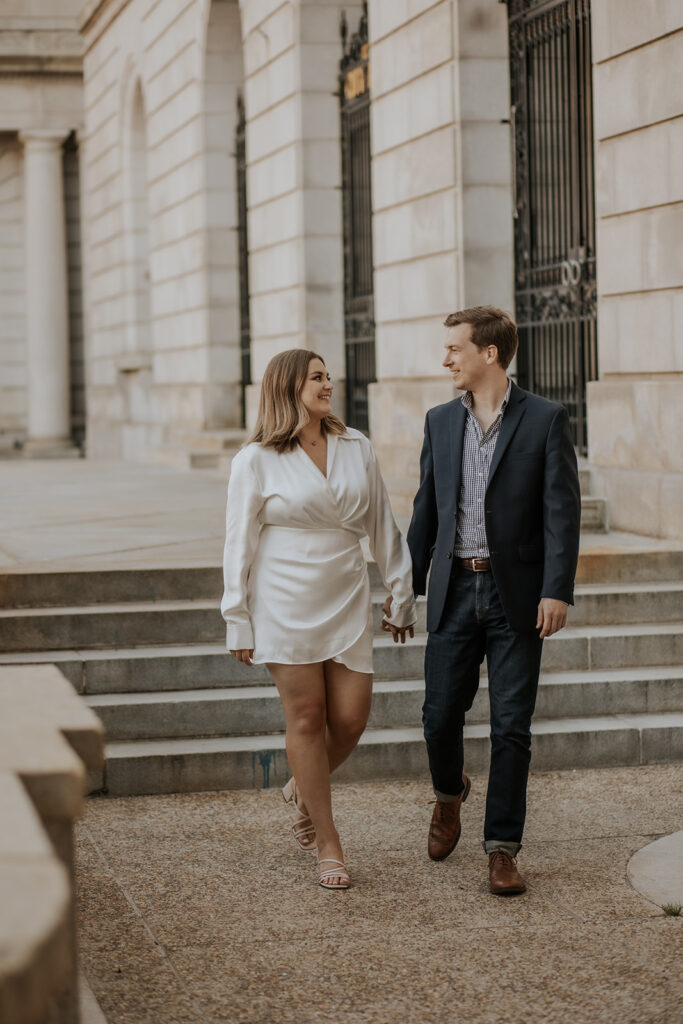 Stylish couple walking outside Portland Maine City Hall.