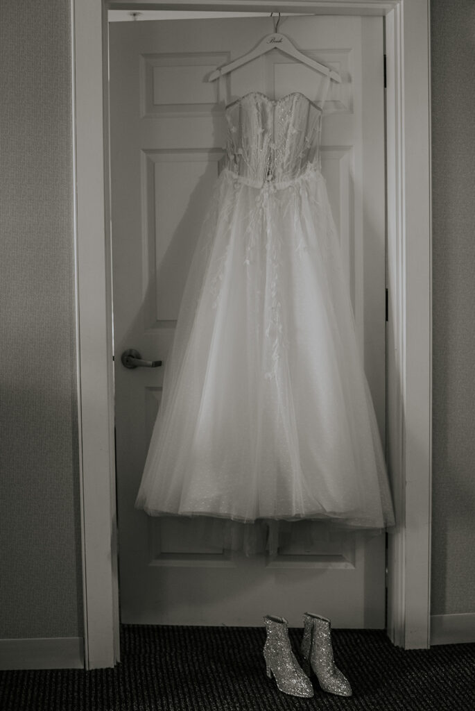Wedding dress hanging detail photo.