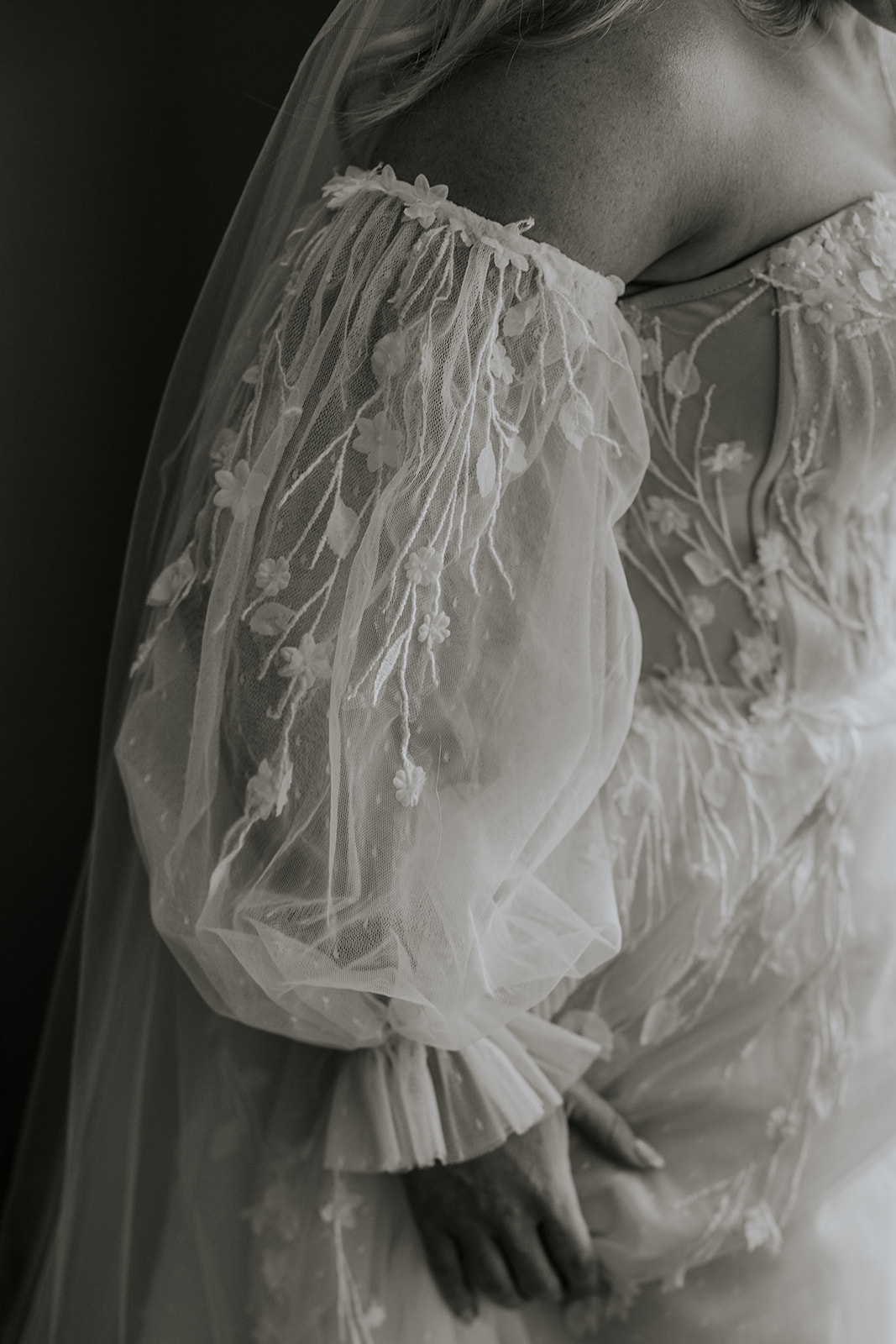 Fine art bridal portrait of detached puff sleeves with floral details.