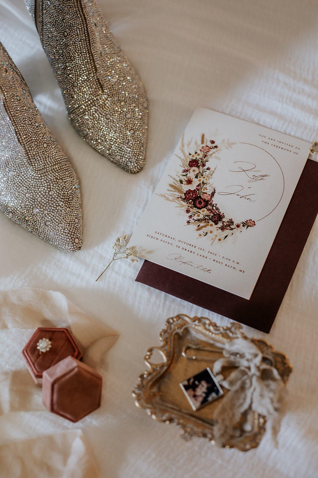 Fall plum wedding detail flat lay.
