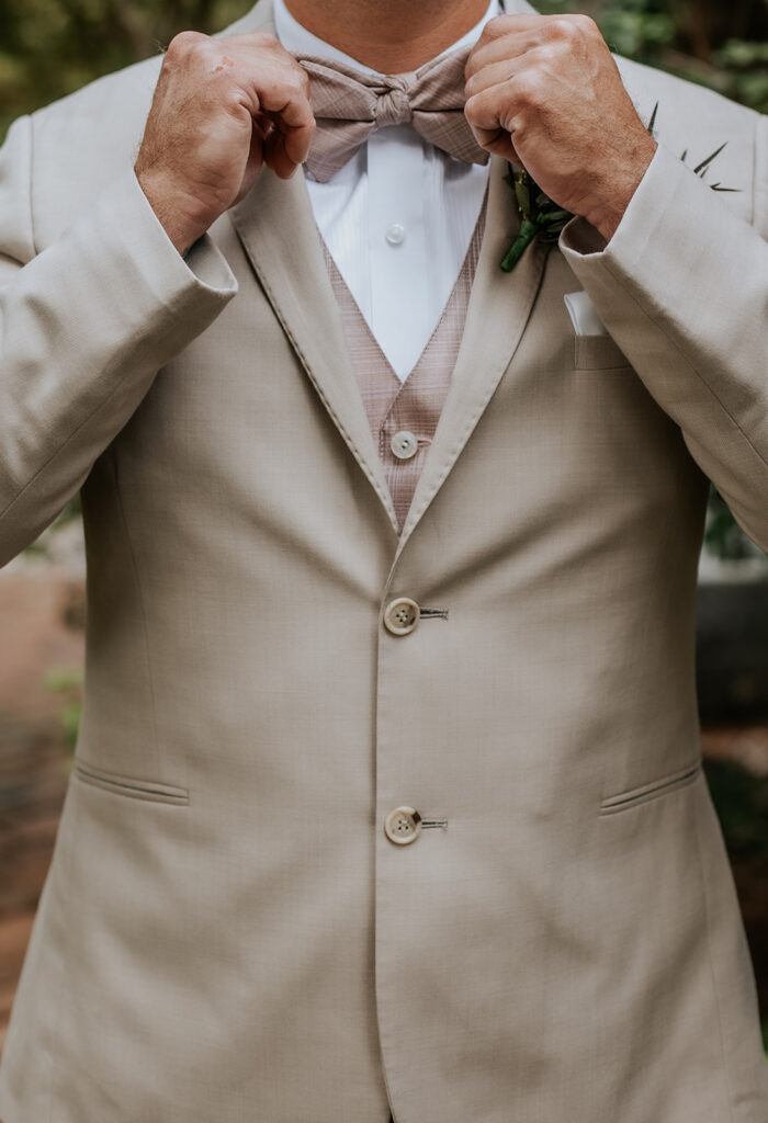 Tan and dusty mauve groom tuxedo.