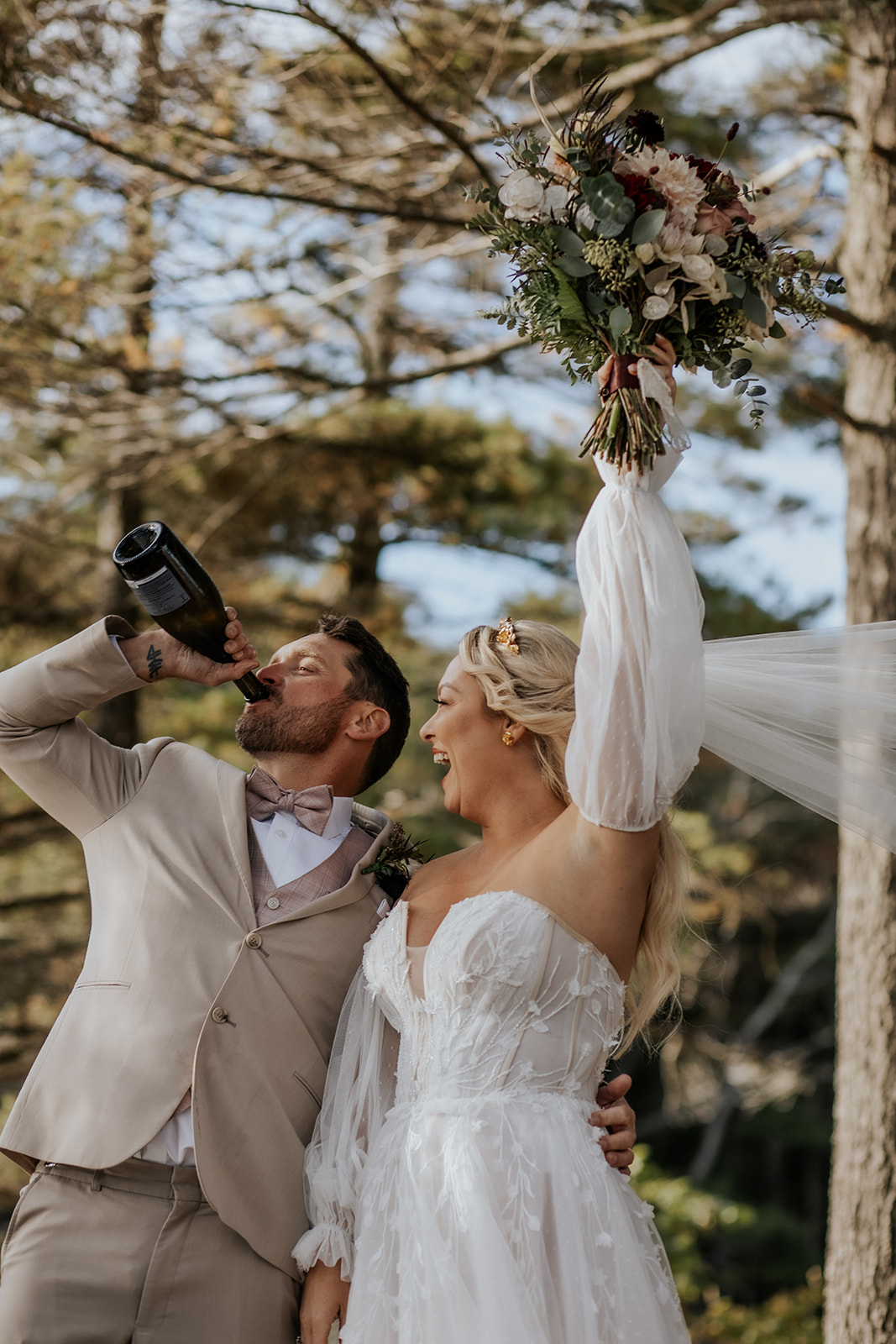 Groom drinking champagne and celebrating after the ceremony.