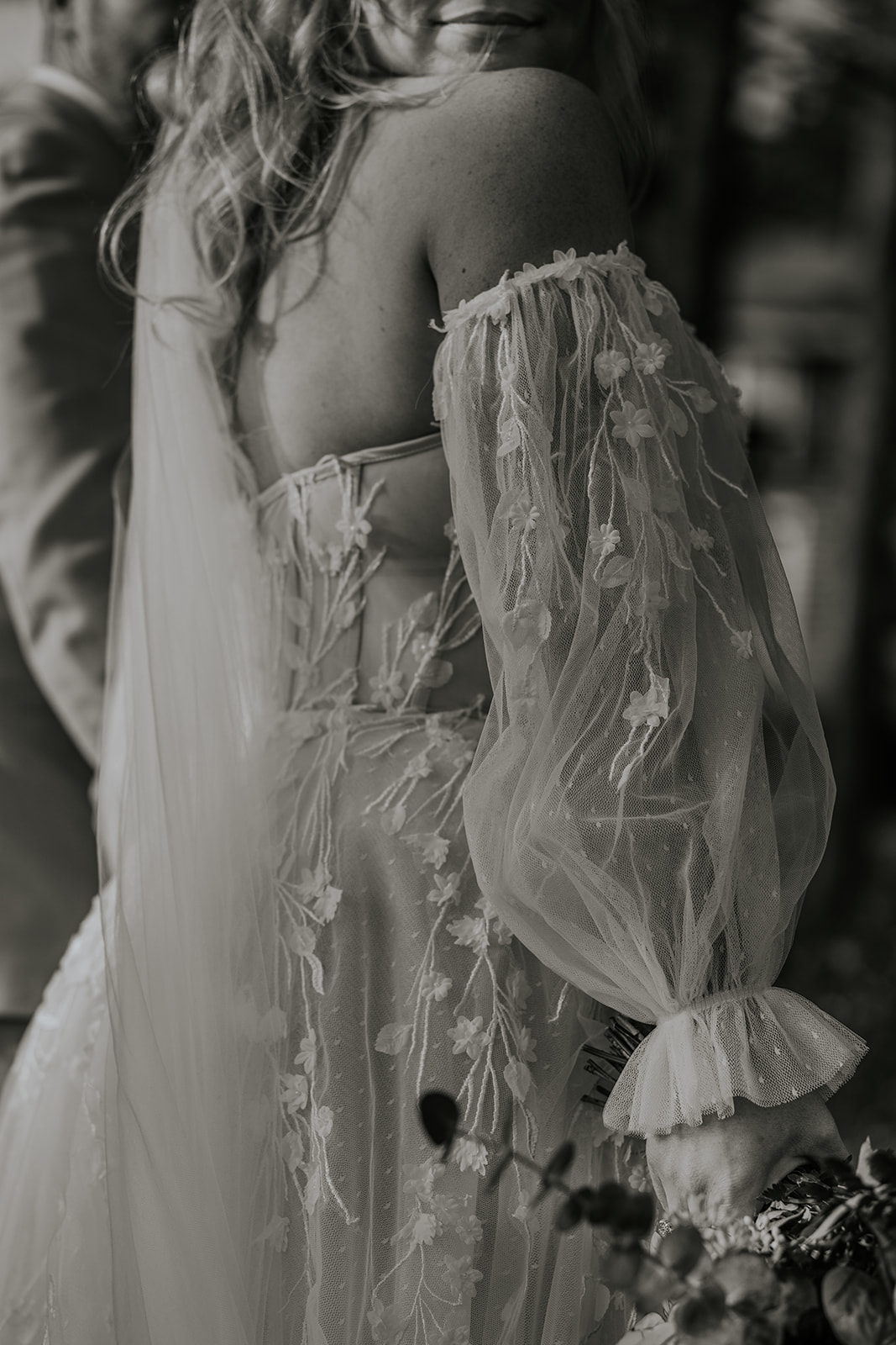 Bridal fine art detail photo with detached puff sleeves.
