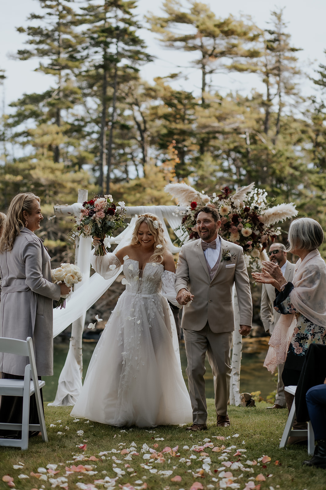 Bride and groom recessional and flower petal toss.