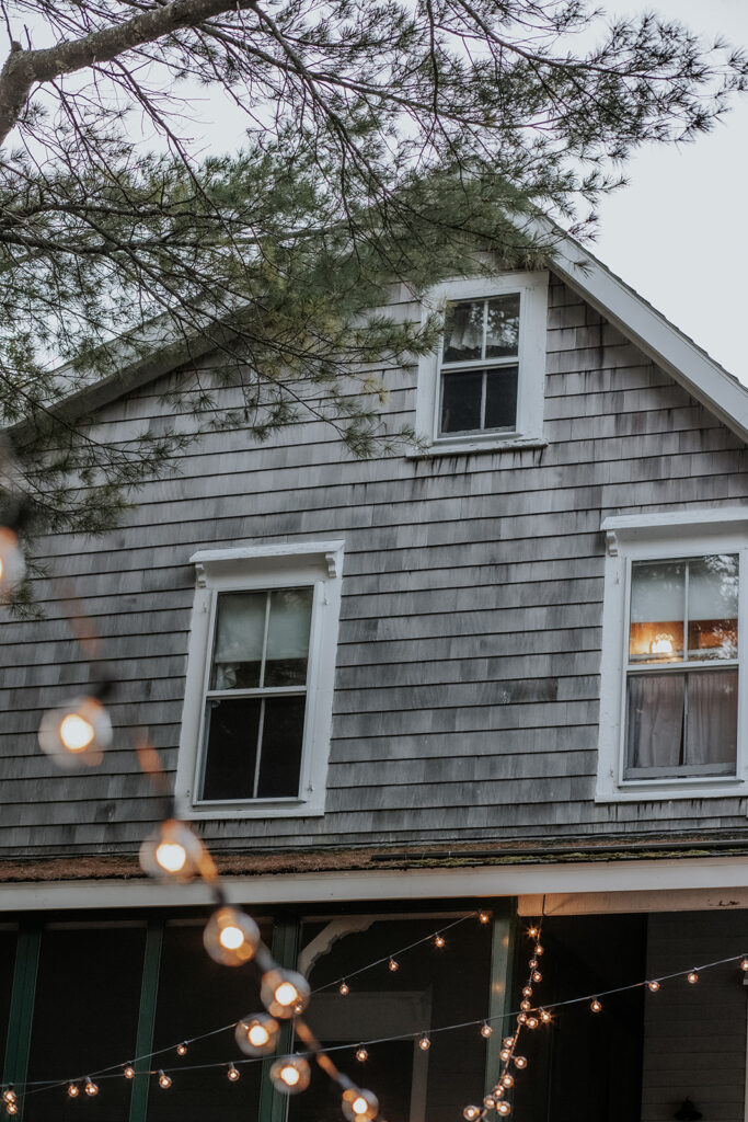Rustic home in Maine with string lights.