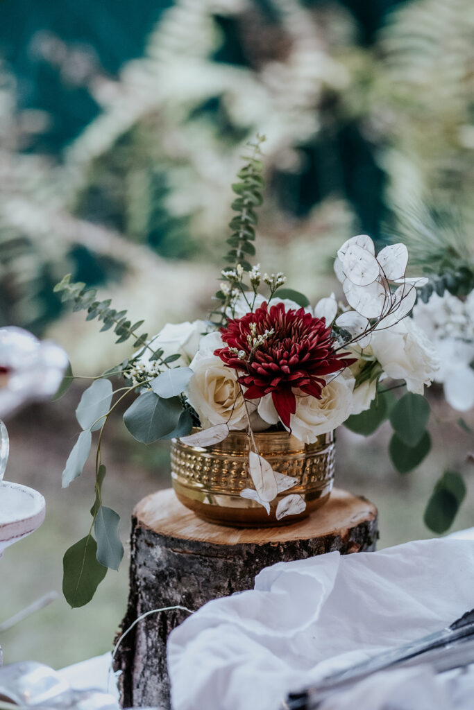 Rustic vintage wedding vase with floral bouquet.