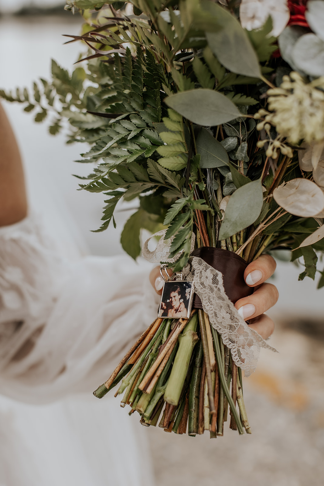 Bridal bouquet with photo of loved one.