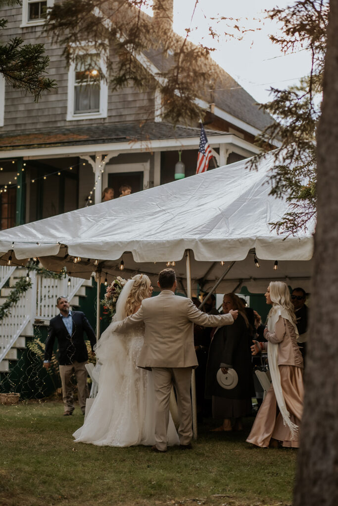 Outdoor tented wedding reception at a private estate in Bath, Maine.