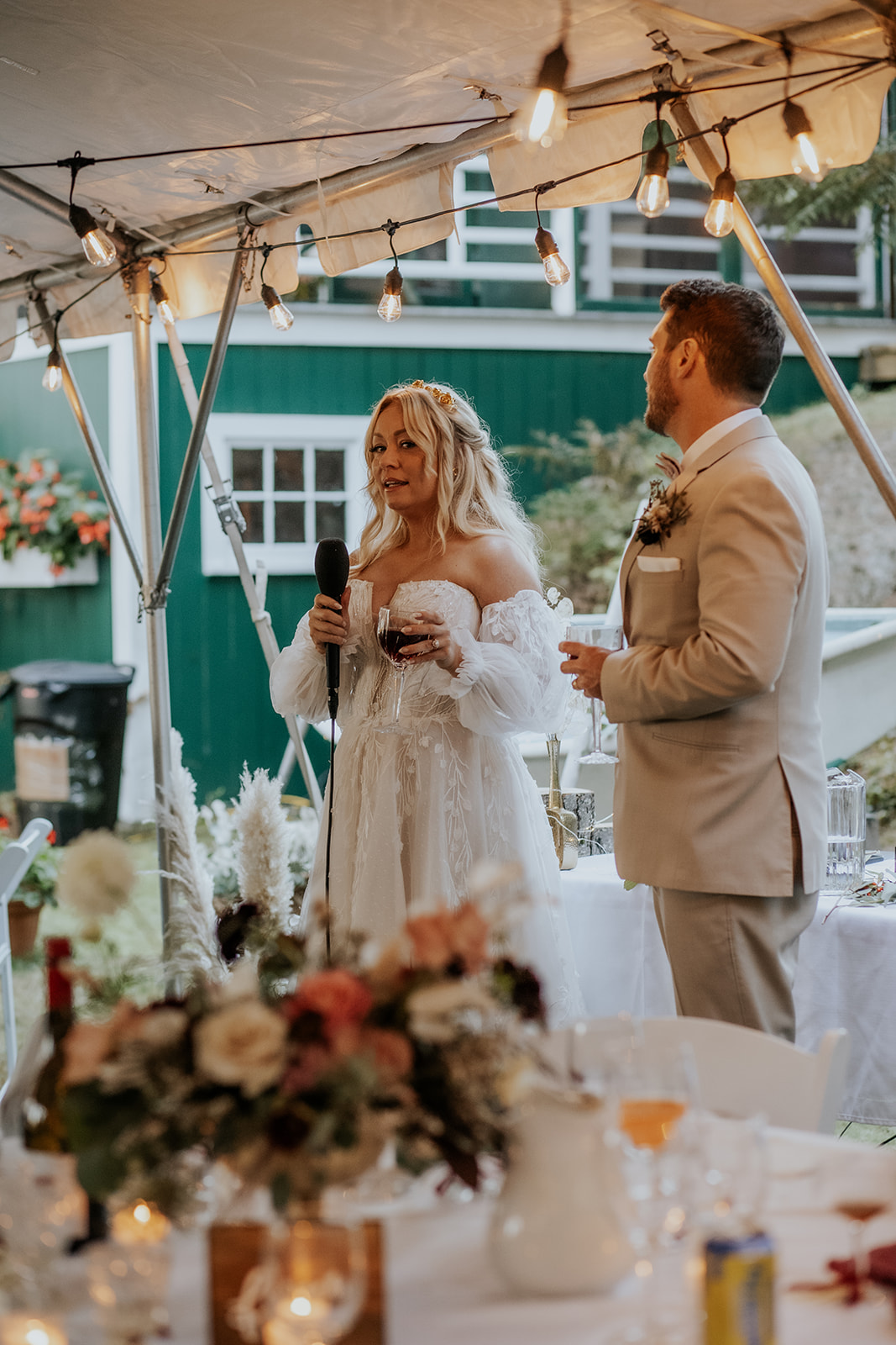 Bride and groom giving reception welcome speech.