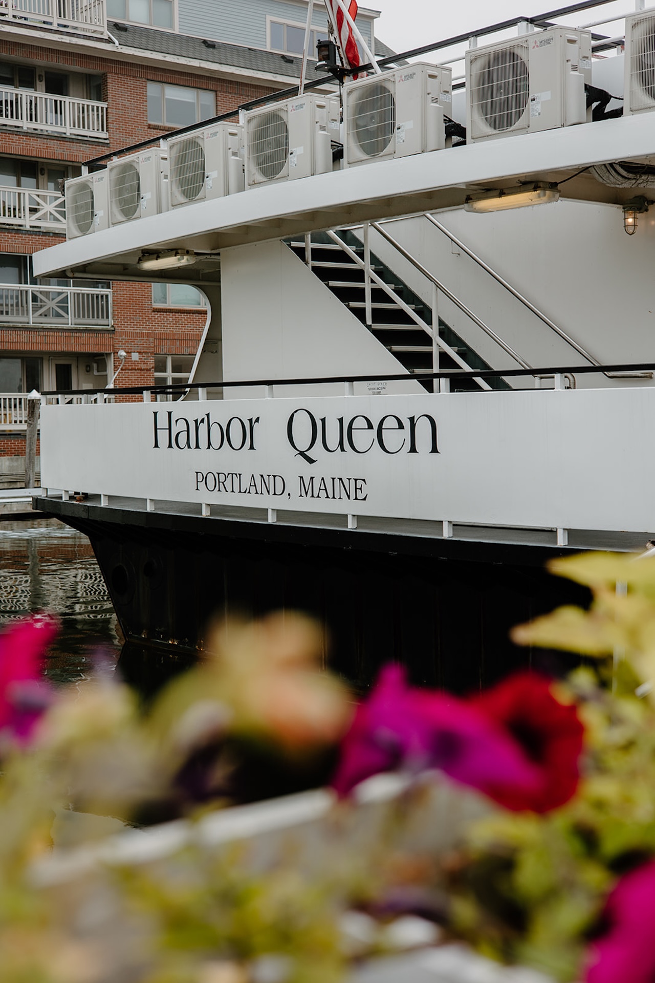 The Harbor Queen boat docked in Portland, Maine, decorated with flowers, a coastal-inspired detail for Destination Wedding Location Ideas.