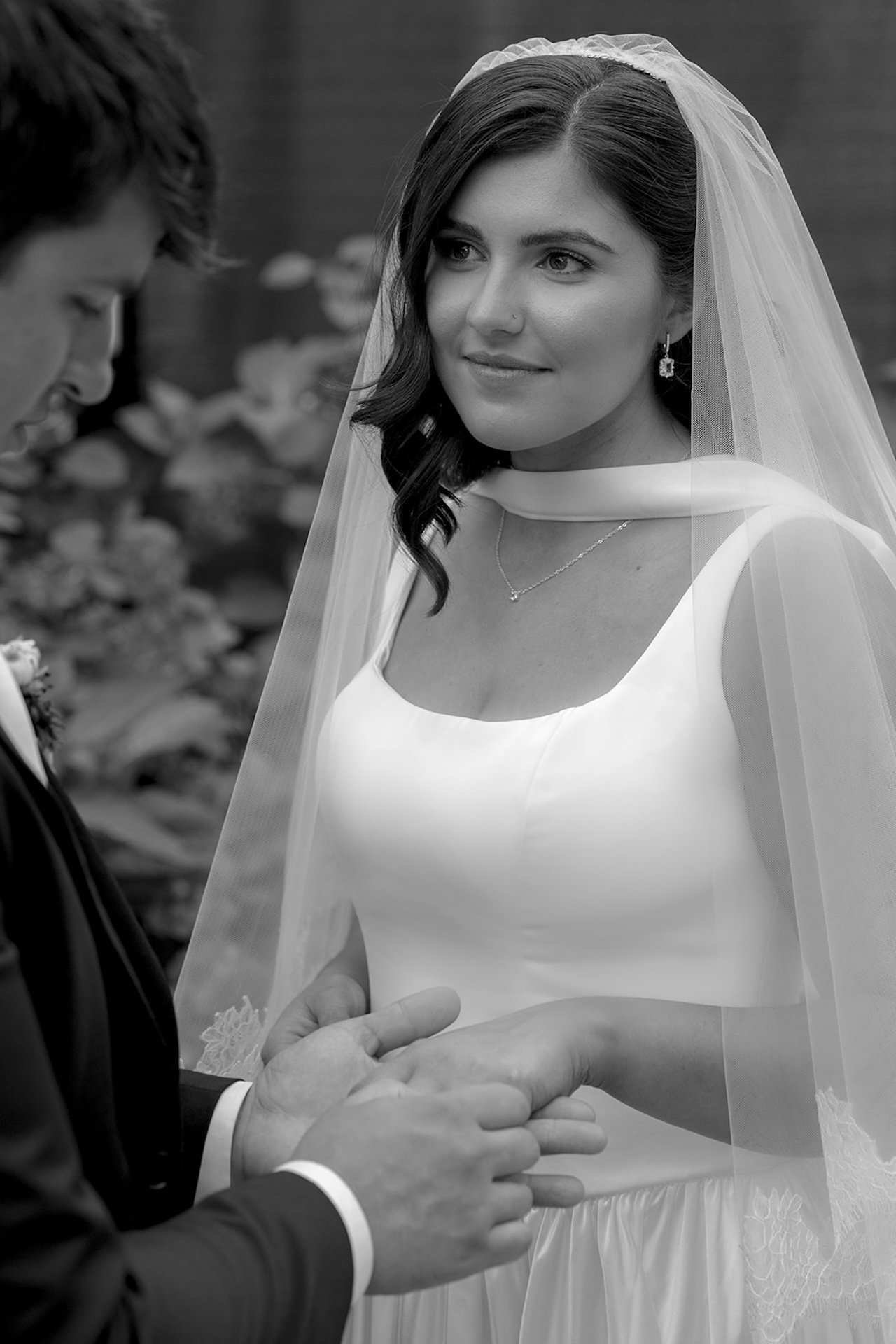 A black-and-white close-up of the bride listening during the ring exchange.
A timeless ceremony moment at one of Maine’s Historic Wedding Venues.