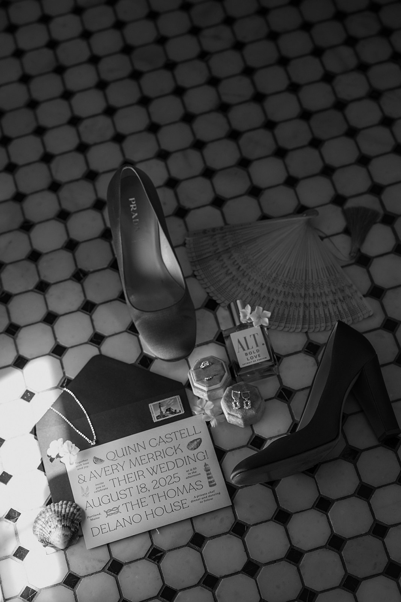 Their wedding invitation, heels, jewelry, and perfume arranged together on vintage tile.
Elegant details styled beautifully inside one of Maine’s Historic Wedding Venues.