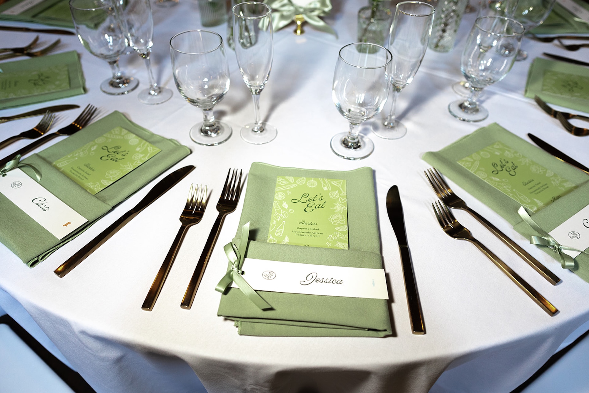 Greena and white reception tablescape from a colorful weddings celebration