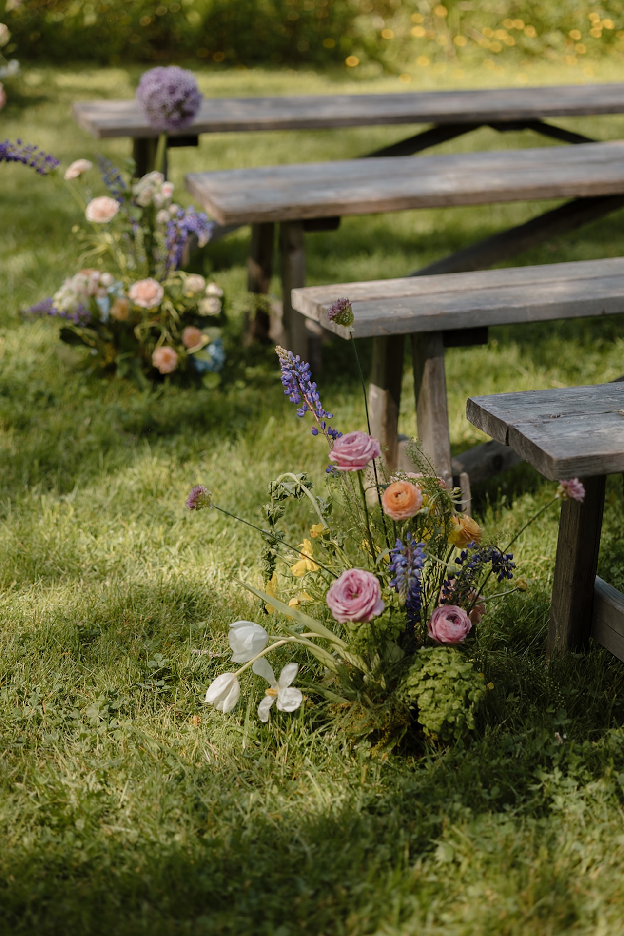 Bright floral arrangements from a colorful weddings ceremony with bold seasonal flowers