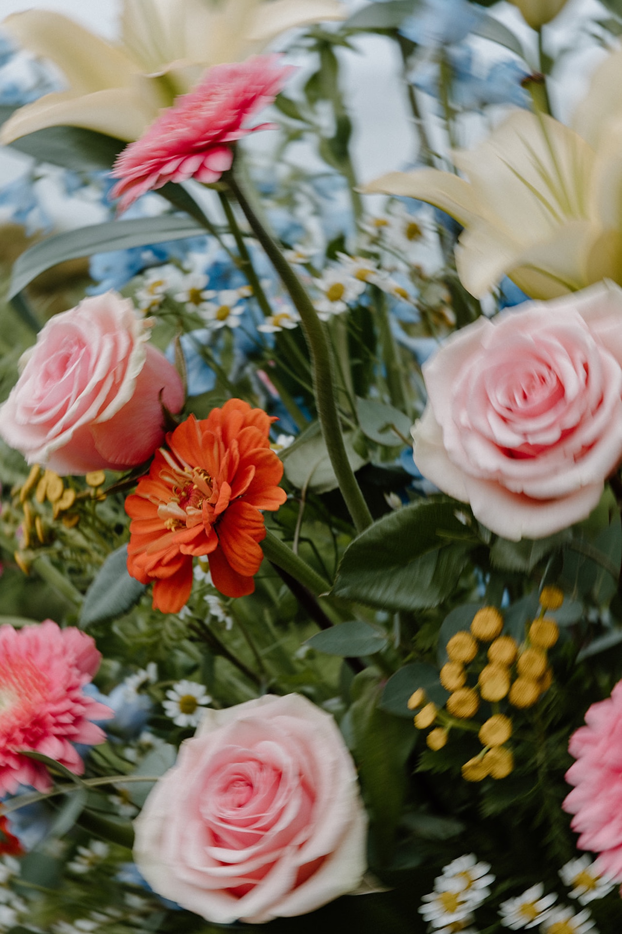 Colorful wedding bouquet featuring vibrant pink and orange flowers