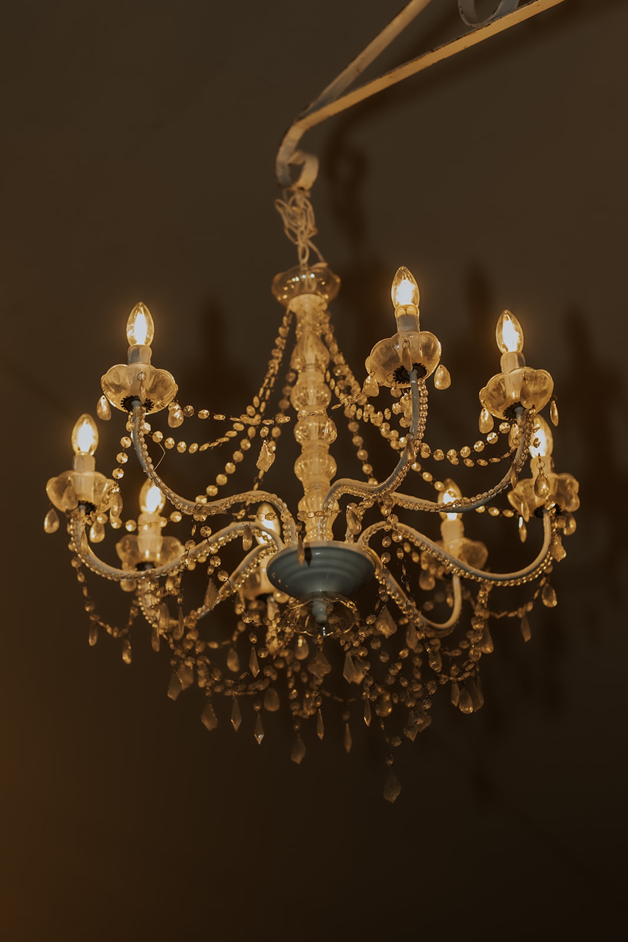 A detail photo of a chandelier hanging in a Maine wedding venue