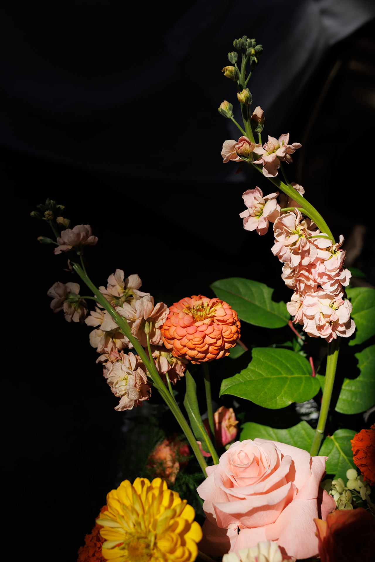Bright floral arrangements from a colorful weddings ceremony with bold seasonal flowers