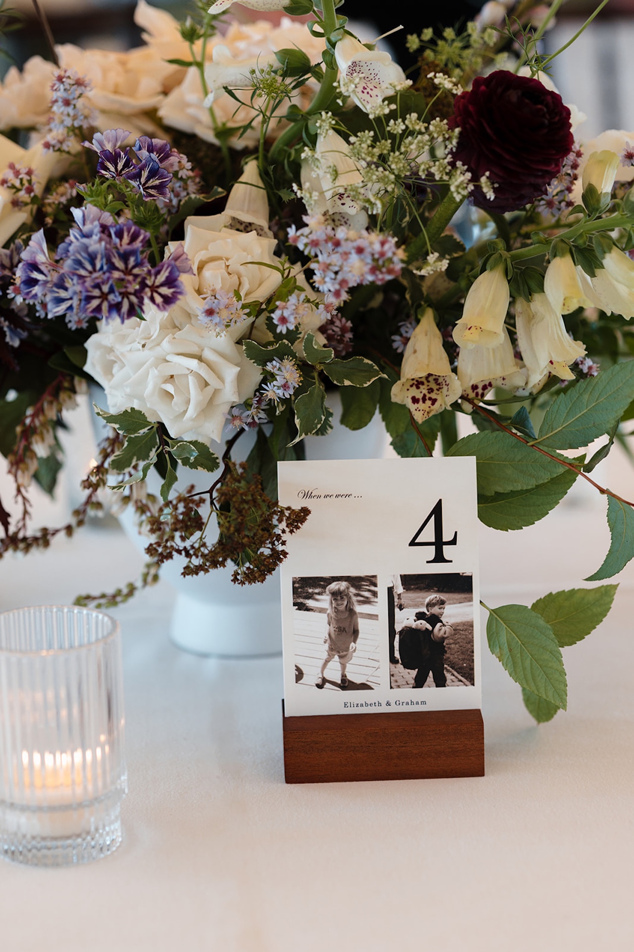 Wedding reception tables with bright florals and table cards displayed during colorful weddings celebration