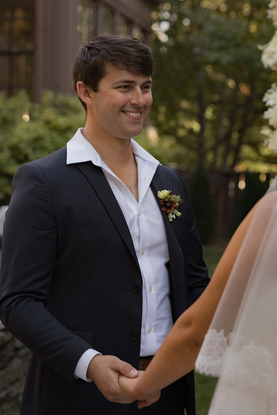 Groom smiling during an intimate wedding ceremony