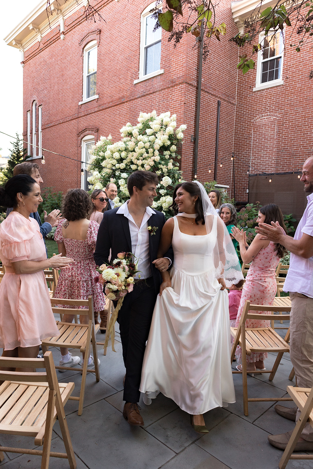 Couple walking down the aisle at an intimate wedding