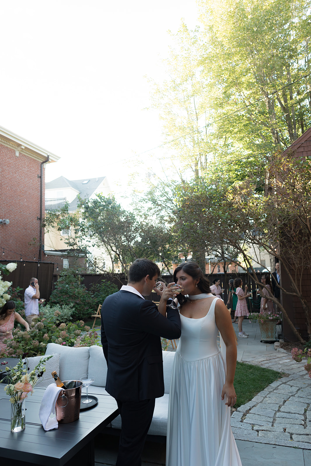 Couple mingles outdoors during an intimate wedding celebration