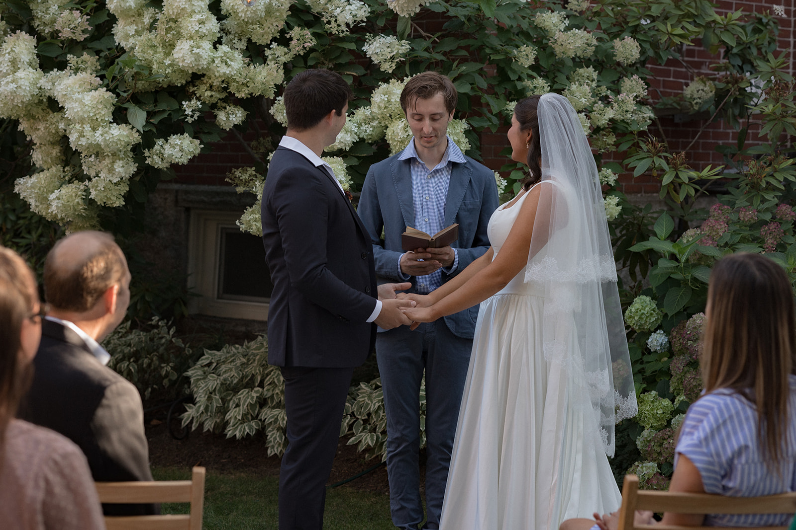 Bride and groom say vows during intimate wedding ceremony