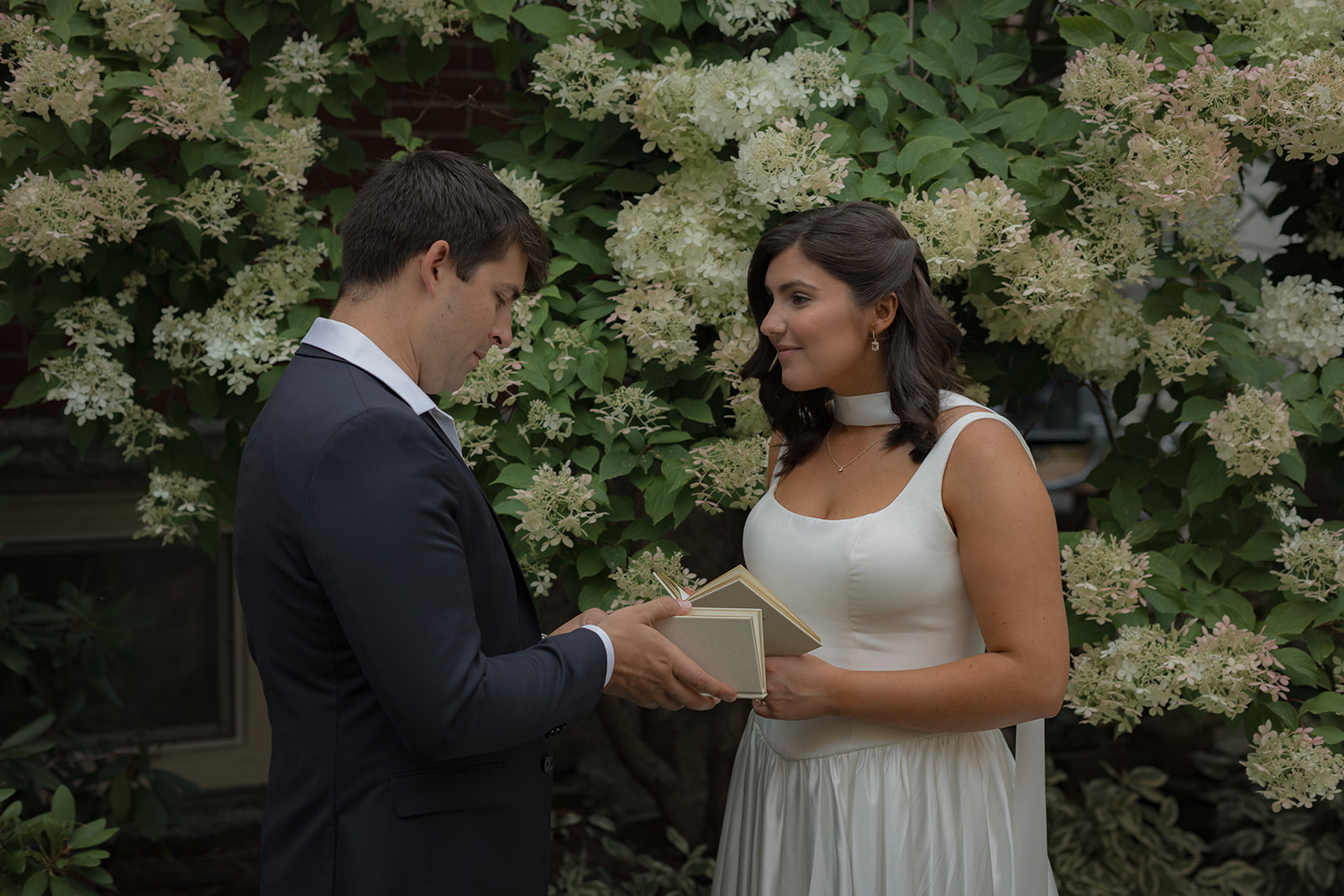 Bride and groom read private vows