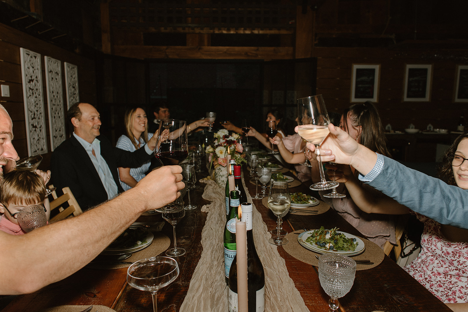 Guest cheers at traditional wedding reception