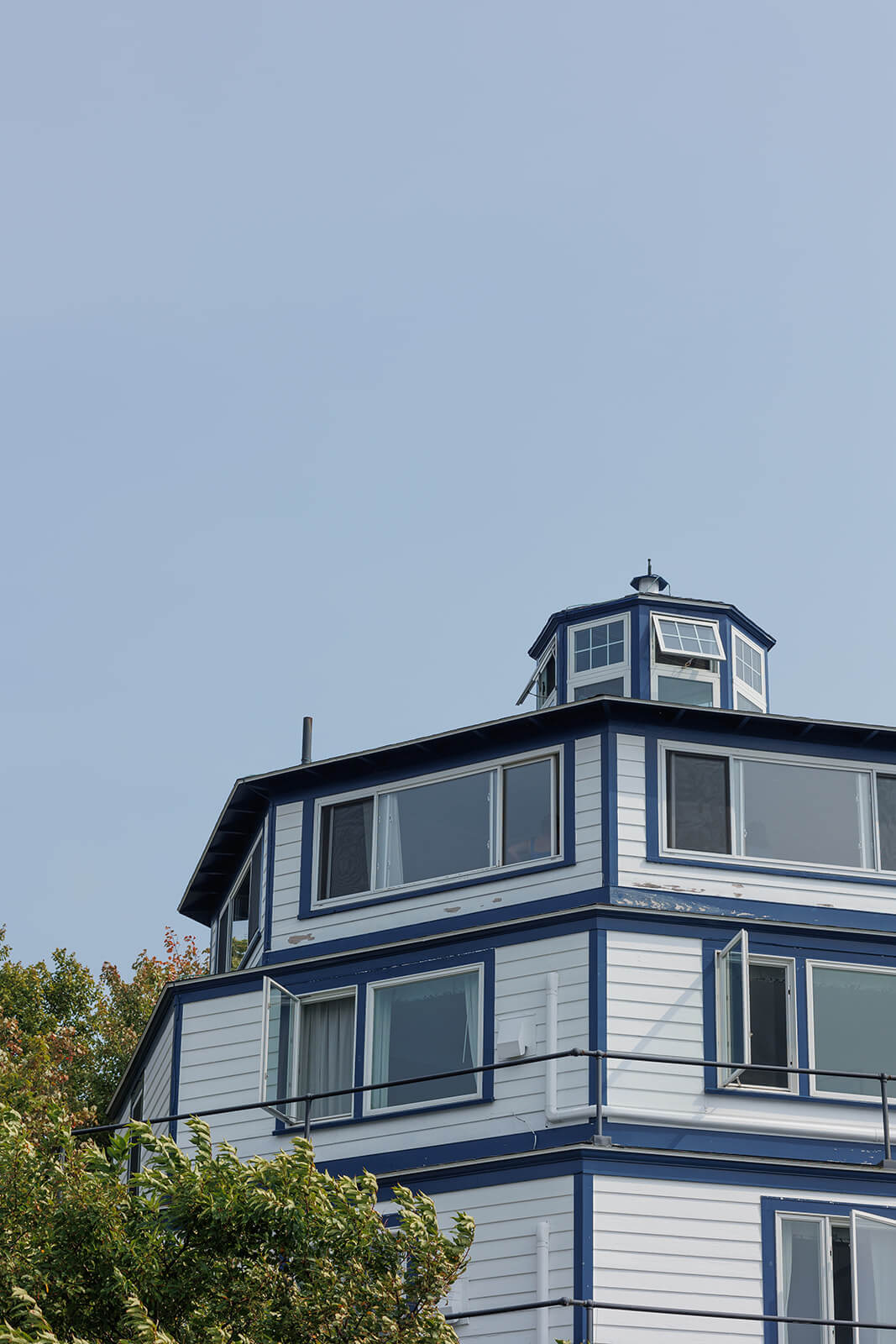 Blue and white waterfront building at Sebasco Harbor Resort in coastal Maine.