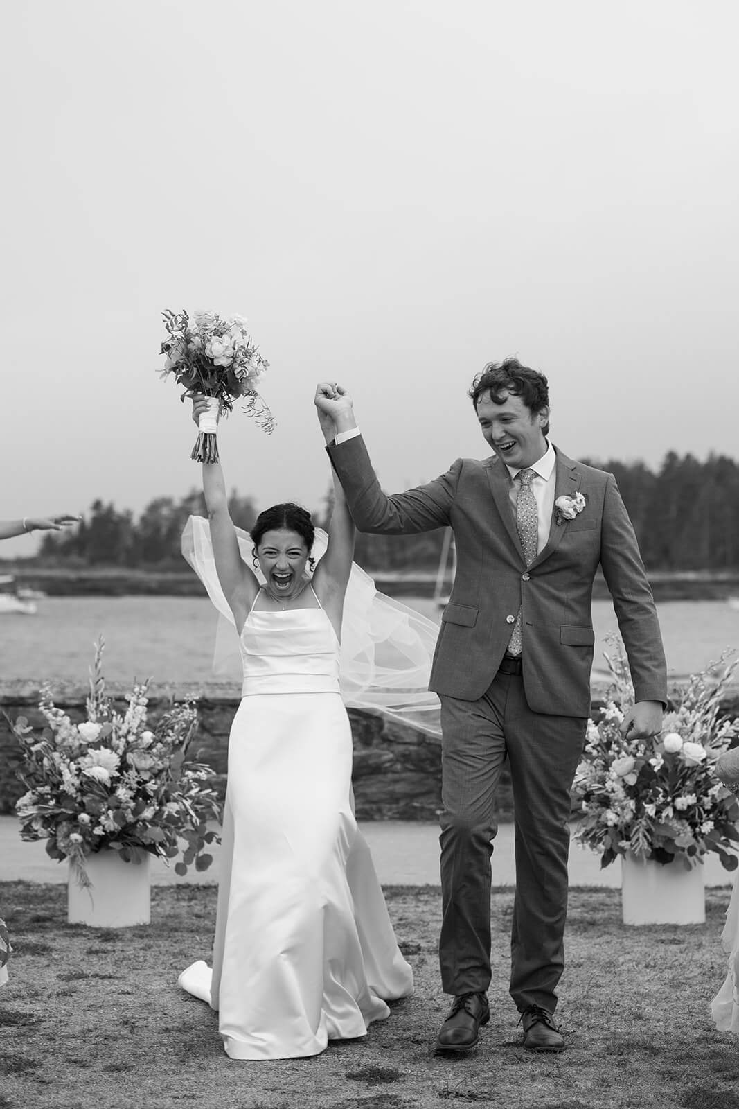 Wedding guests smiling during an intimate coastal Maine micro wedding ceremony at Sebasco Harbor Resort.