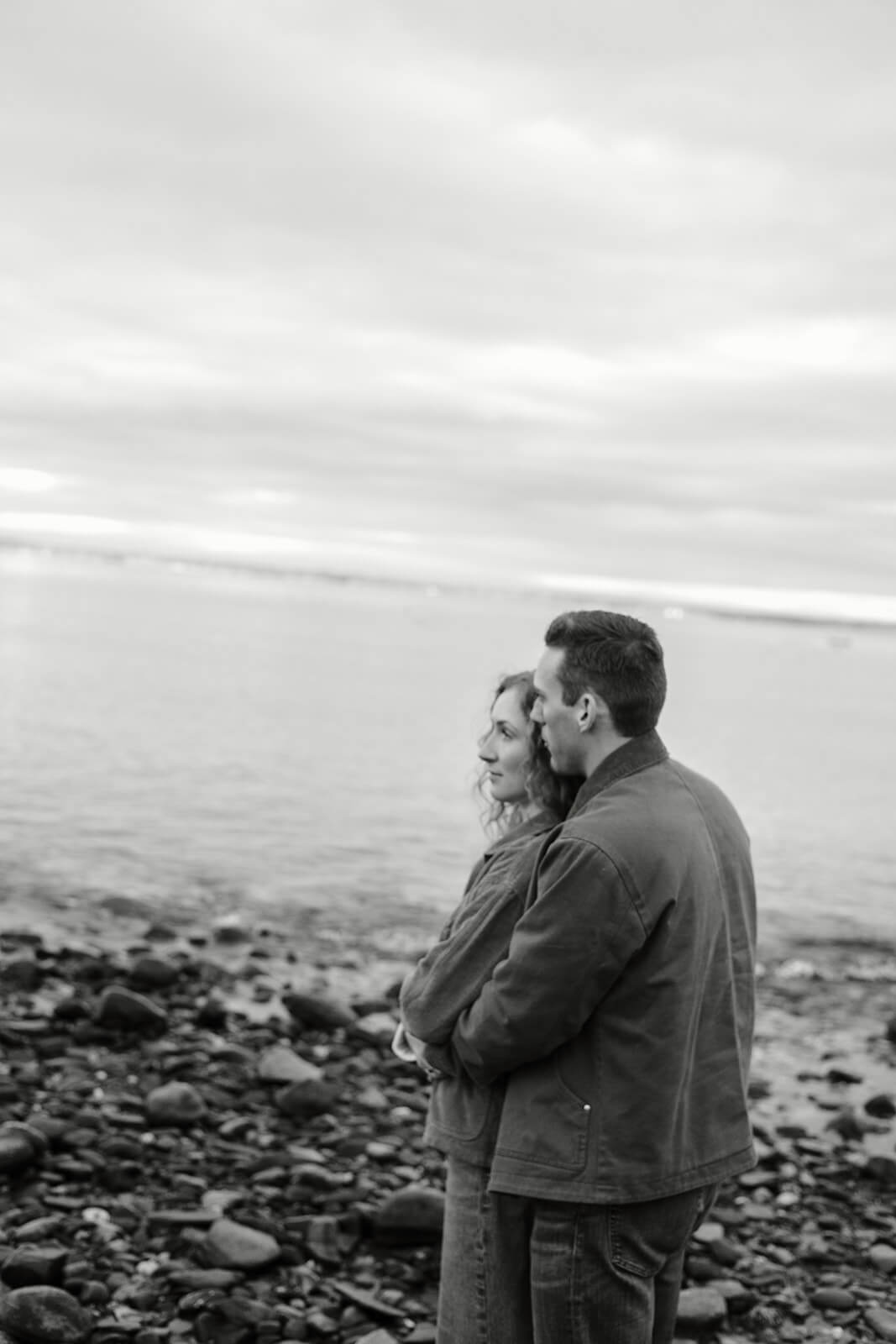 Black and white portrait from a rocky beach engagement photoshoot in coastal Maine